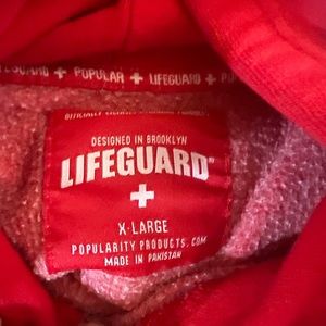Red lifeguard sweatshirt